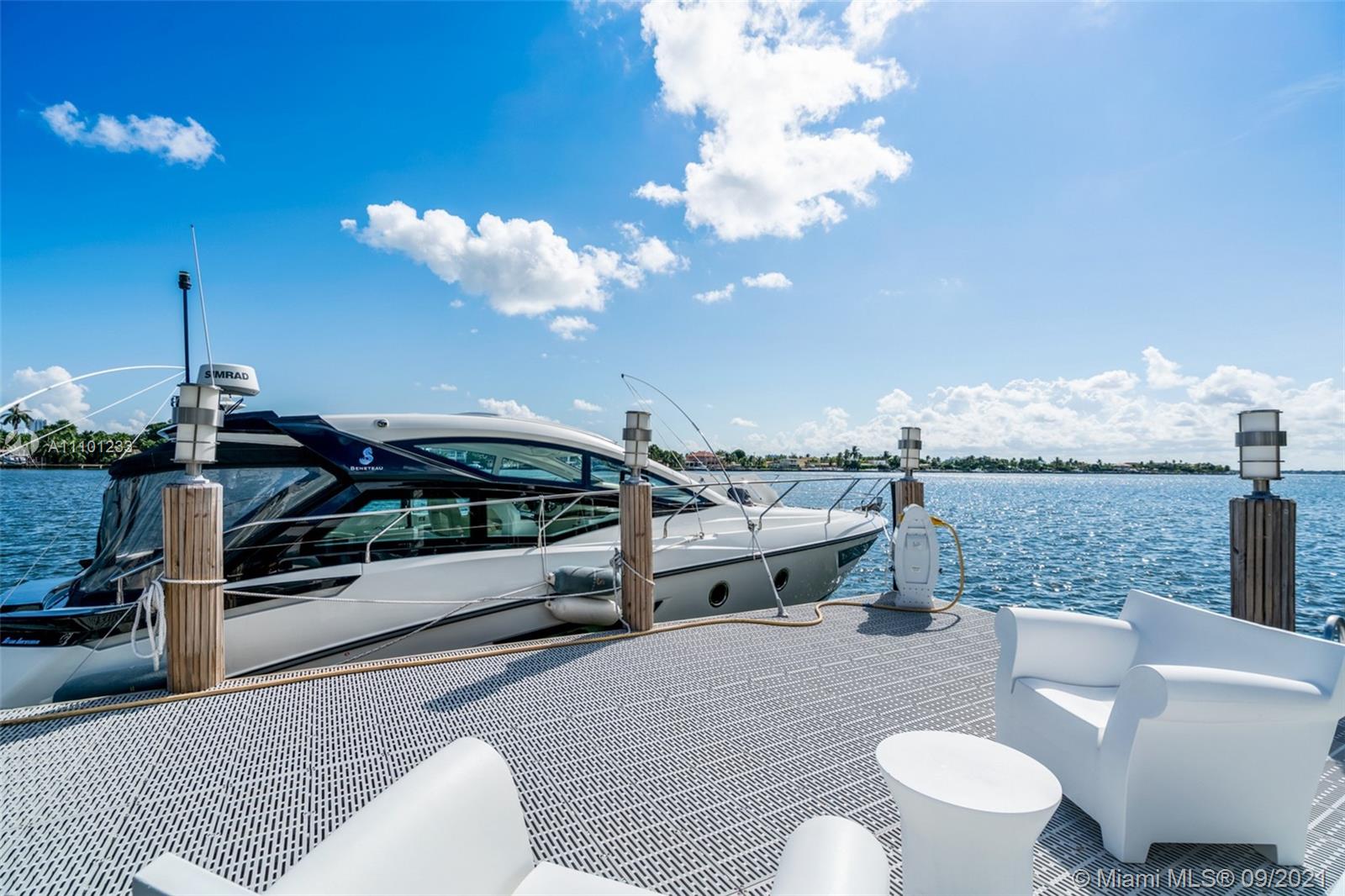 1236 Biscaya Drive Surfside, FL 33154 - Photo 36 of 40 a living room with furniture a rug and a fireplace