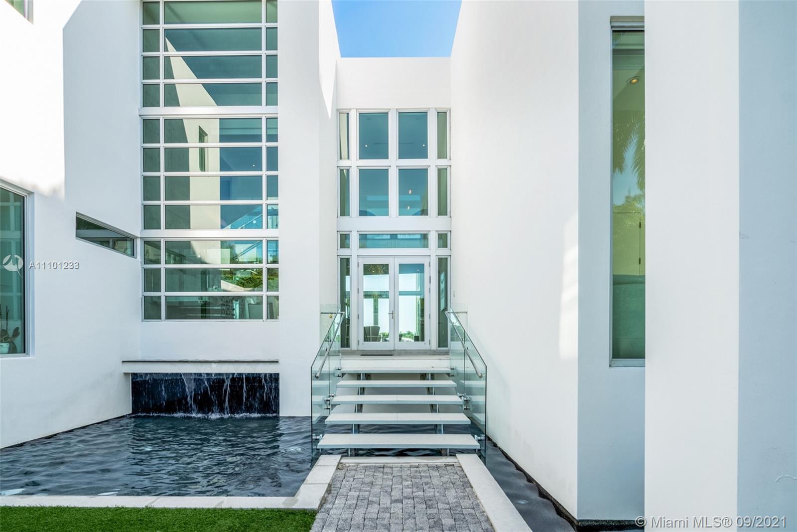 1236 Biscaya Drive Surfside, FL 33154 - Photo 8 of 40 a front view of a house