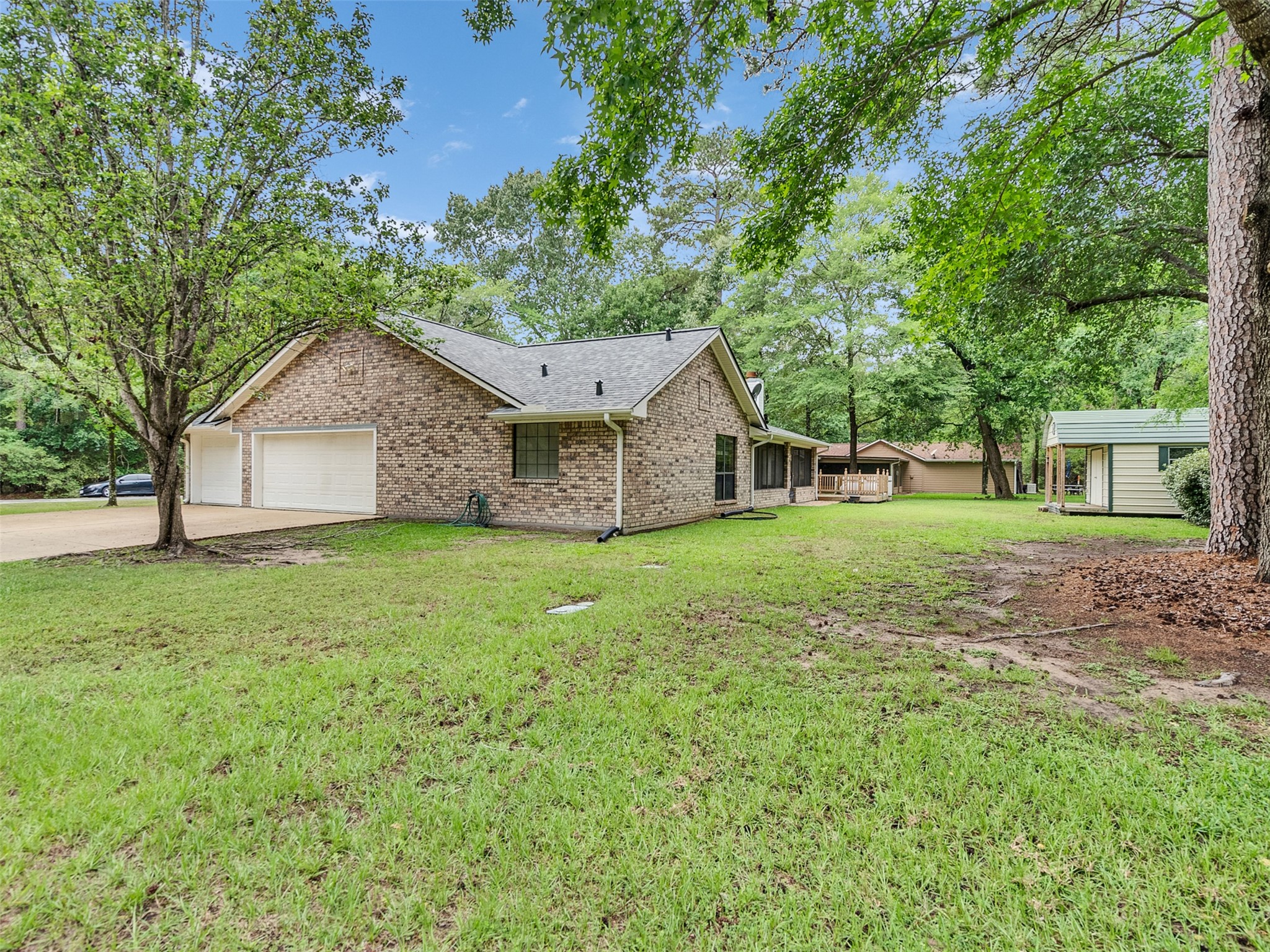195 Coral Gables Trinity, TX 75862 - Photo 45 of 50 a front view of house with yard and green space