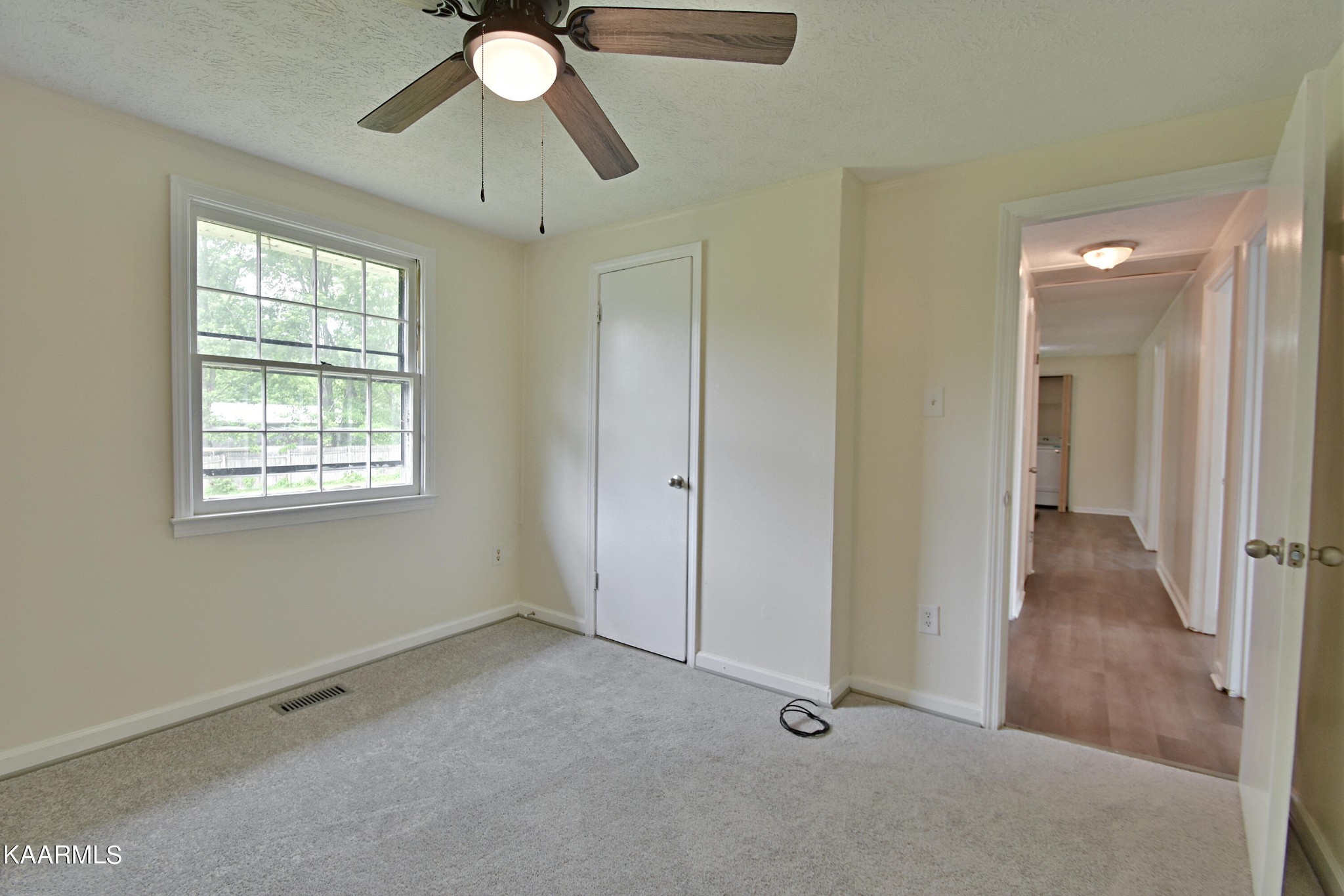 7715 Nicholas Drive Corryton, TN 37721 - Photo 13 of 16 wooden floor in an empty room with a window
