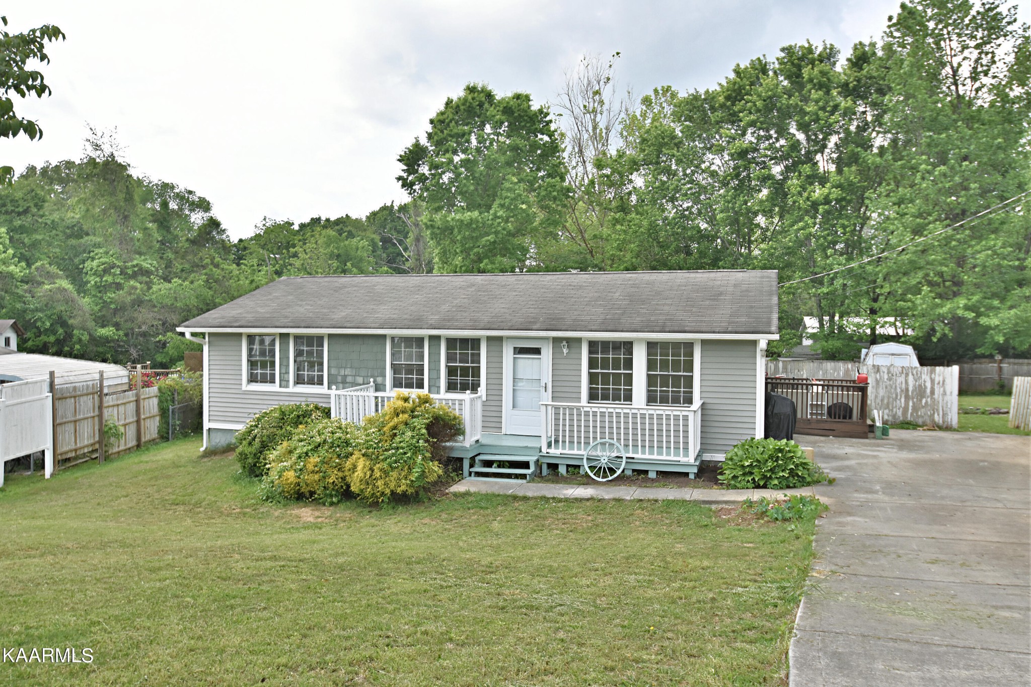 7715 Nicholas Drive Corryton, TN 37721 - Photo 2 of 16 a front view of a house with garden