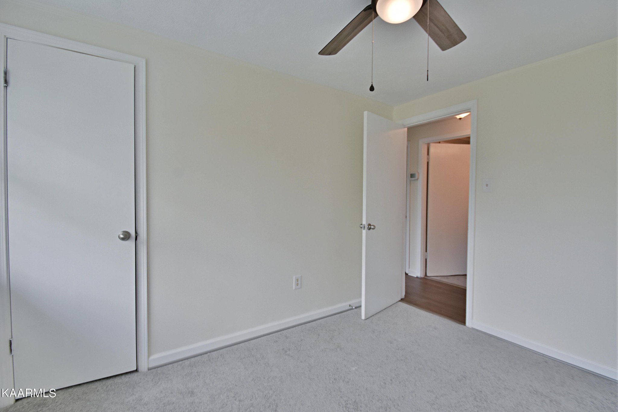 7715 Nicholas Drive Corryton, TN 37721 - Photo 8 of 16 an empty room with chandelier fan and closet