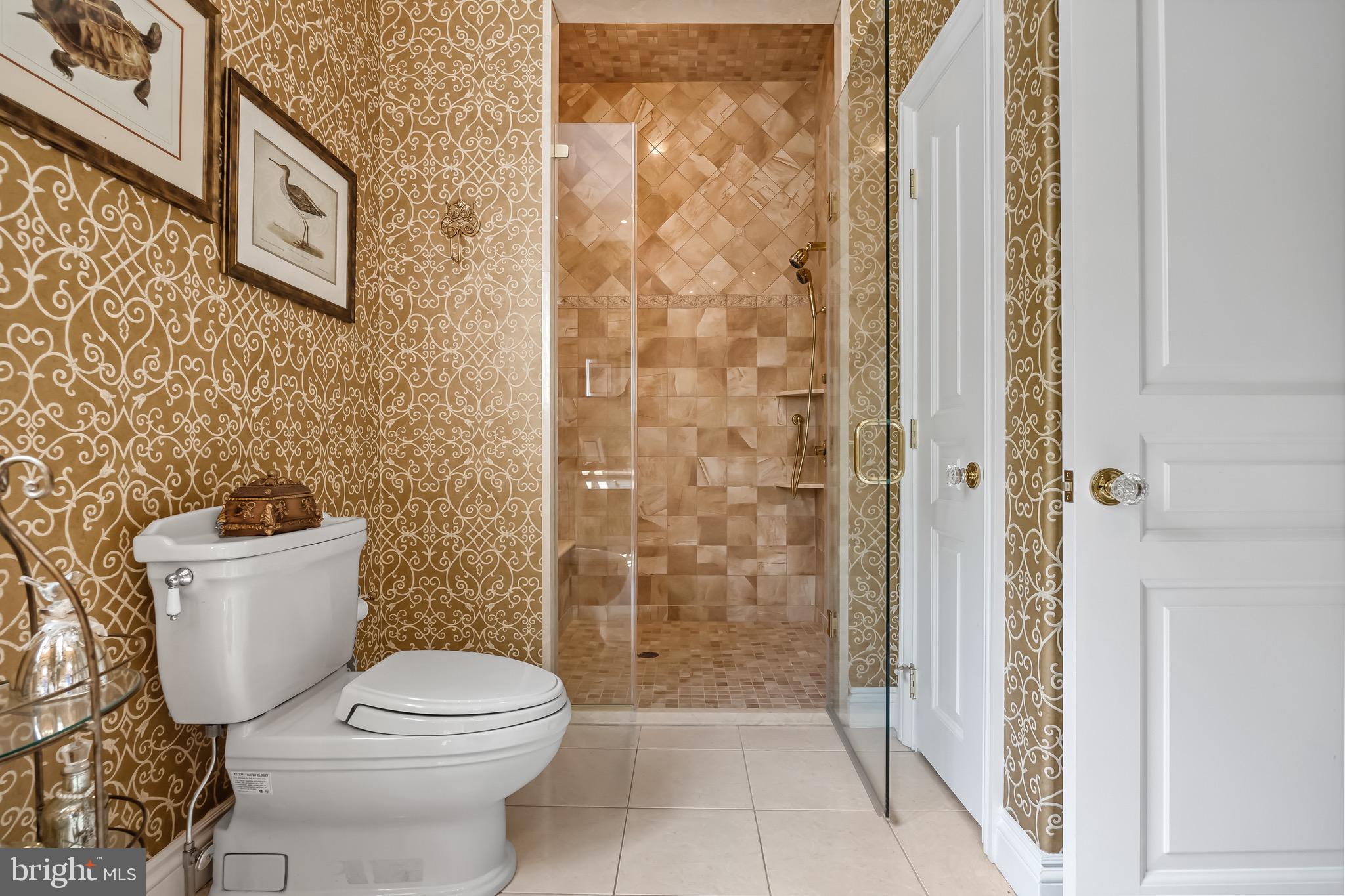 343 Bridgeboro Road Moorestown, NJ 08057 - Photo 38 of 52 a white toilet sitting next to a bathroom sink