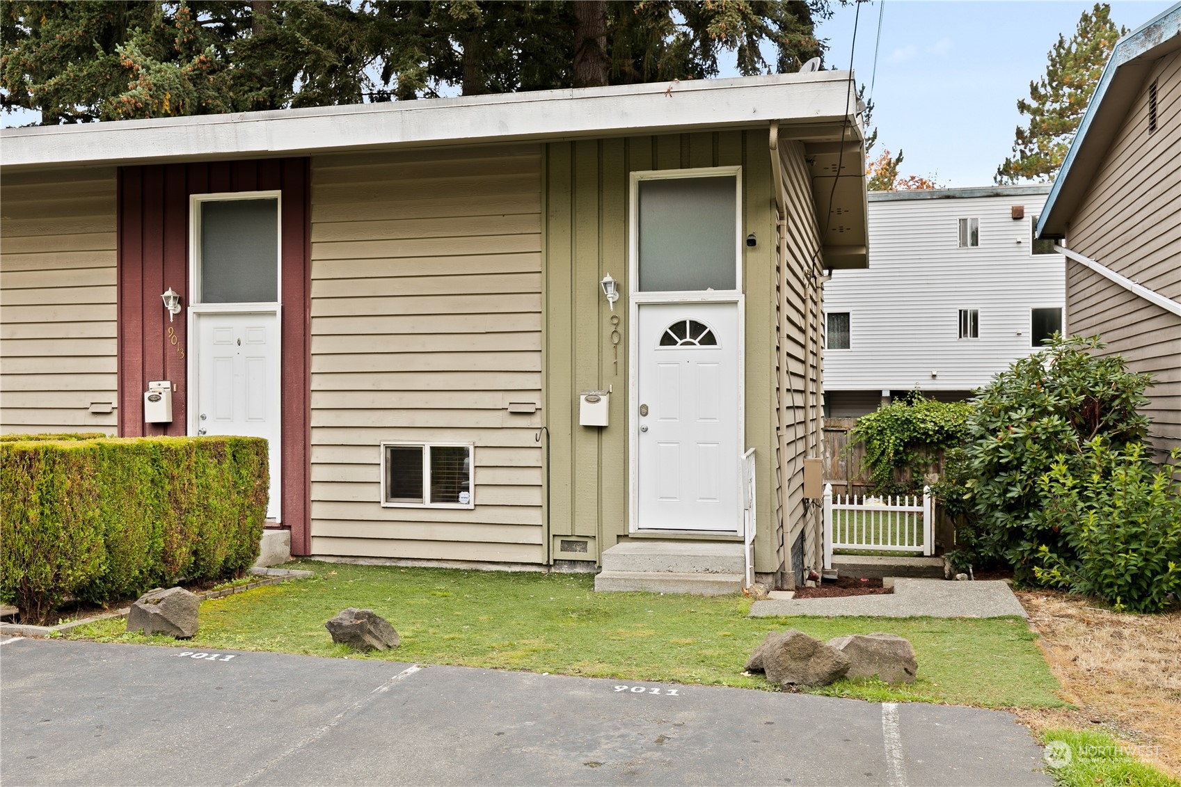 9011 8th Avenue Southwest Seattle, WA 98106 - Photo 1 of 1 a front view of a house with a yard