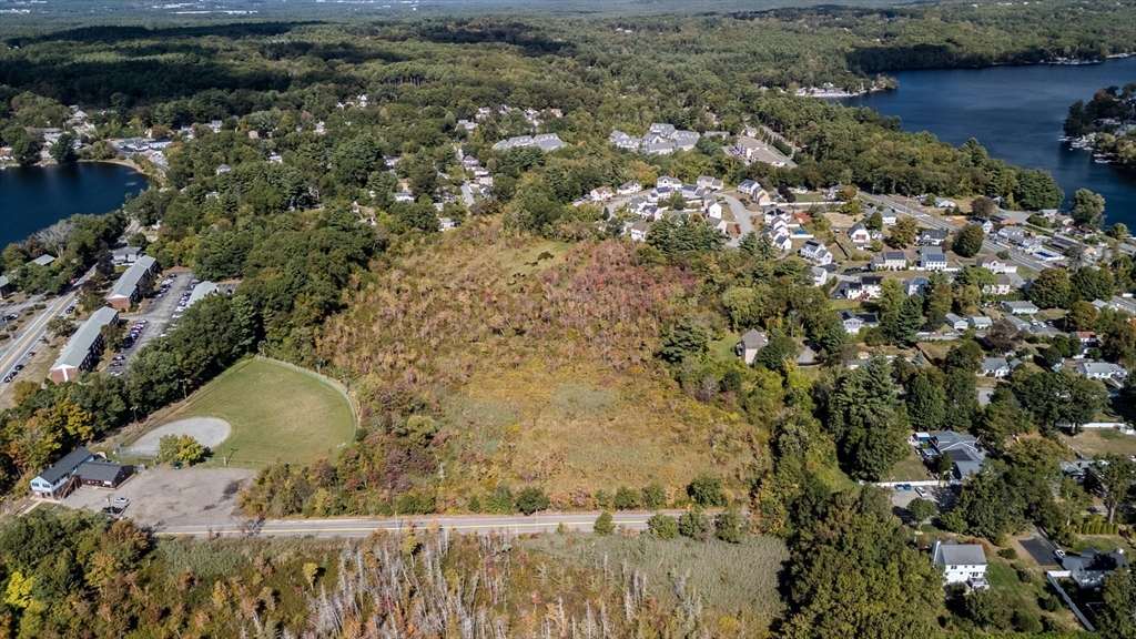 135 Stewart Street, Unit 1 Dracut, MA 01826 - Photo 3 of 3 a view of a lot of trees and houses