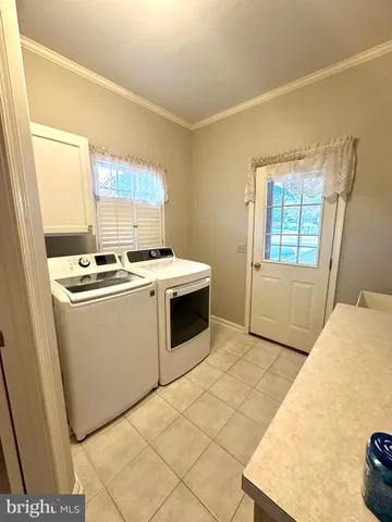 a utility room with washer and dryer