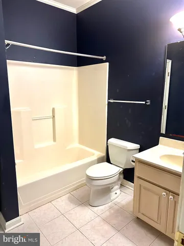 a bathroom with a toilet a sink and a shower