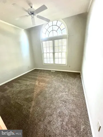 a bathroom with a sink a toilet a mirror and a shower