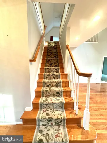 a bathroom with a toilet a sink and a window