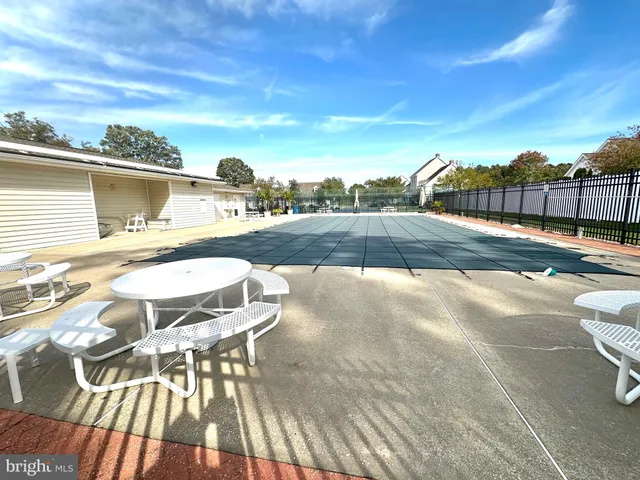 a view of sign board with flower around