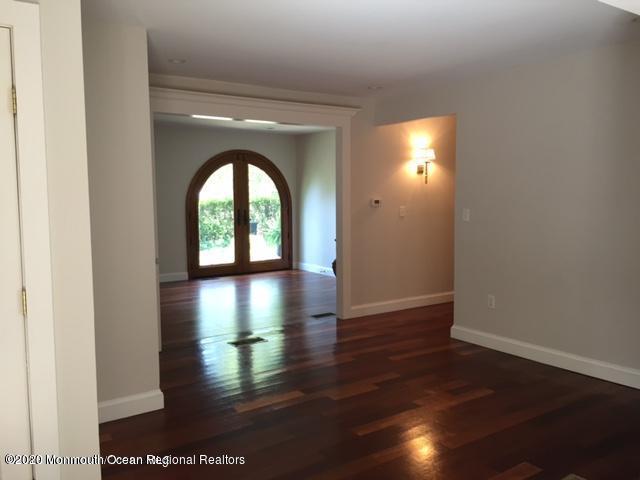 431 Spring Street Little Silver, NJ 07739 - Photo 2 of 15 a view of a hallway with hardwood floor and a floor to ceiling window
