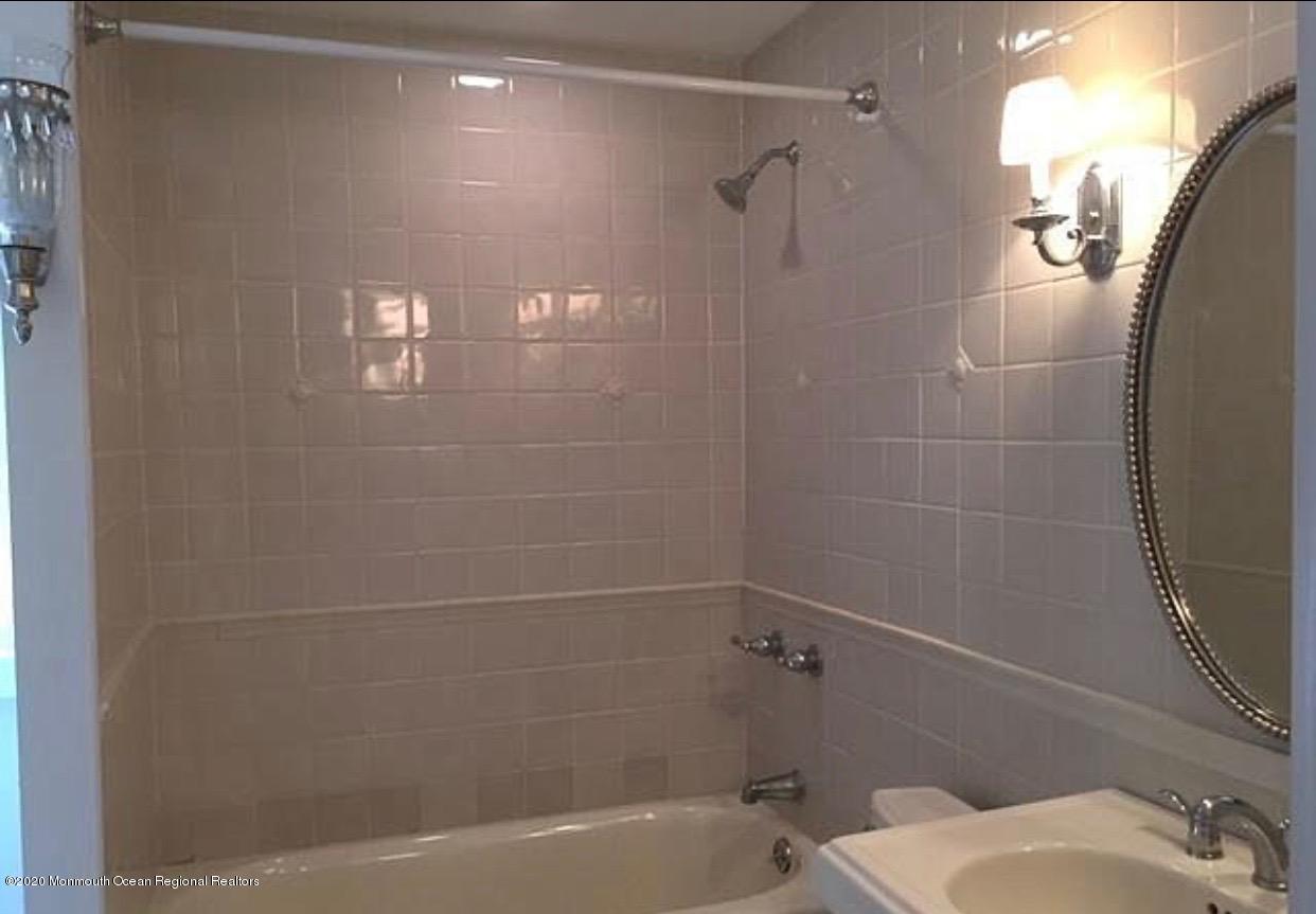 431 Spring Street Little Silver, NJ 07739 - Photo 5 of 15 a bathroom with a bathtub and shower