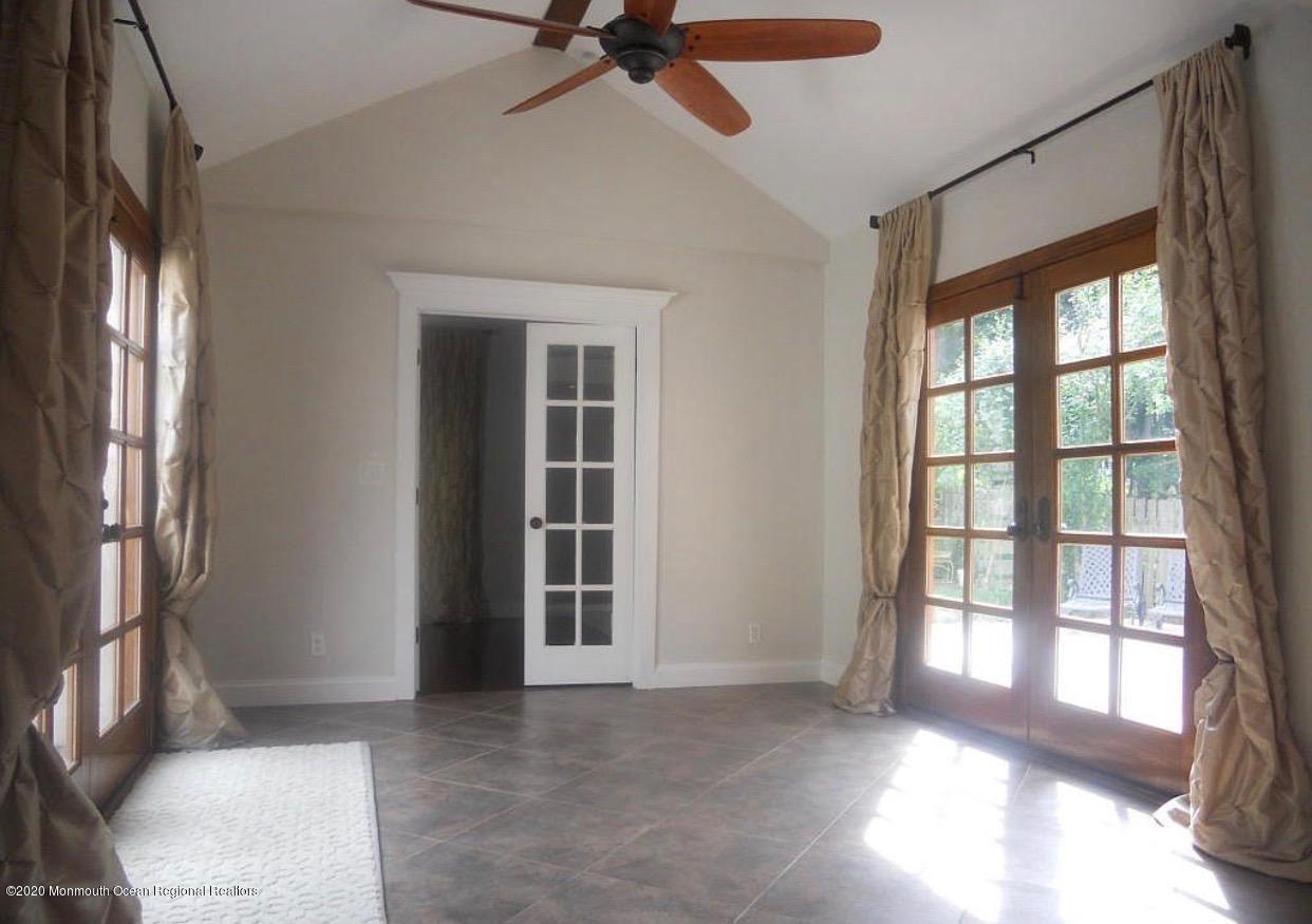431 Spring Street Little Silver, NJ 07739 - Photo 6 of 15 a view of a livingroom with a ceiling fan and window