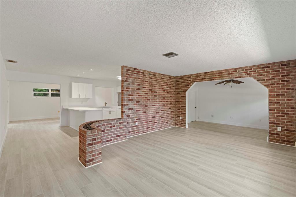 16900 Southwest 62nd Street Southwest Ranches, FL 33331 - Photo 13 of 48 a view of an empty room with wooden floor