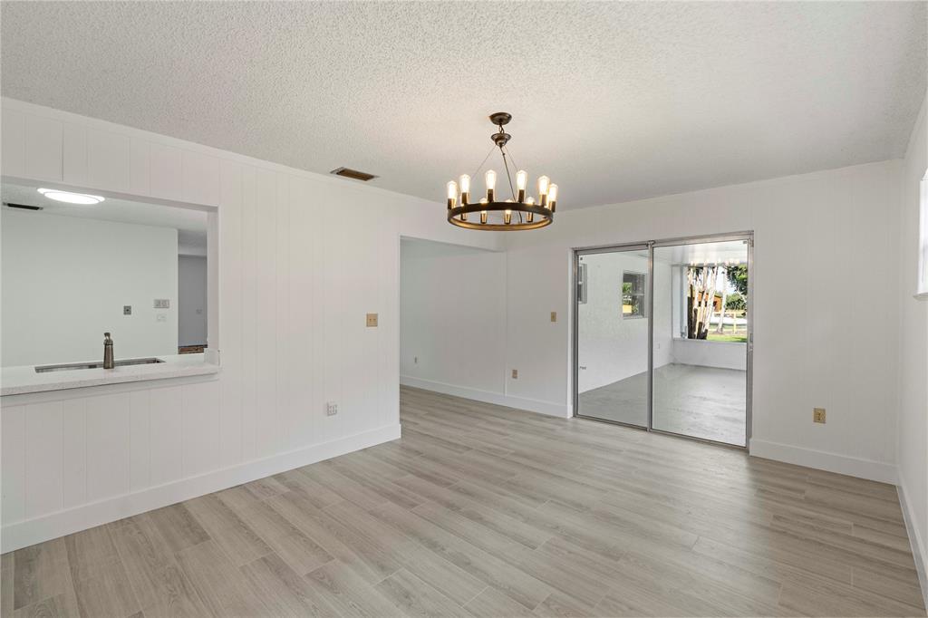 16900 Southwest 62nd Street Southwest Ranches, FL 33331 - Photo 23 of 48 a view of an empty room with wooden floor