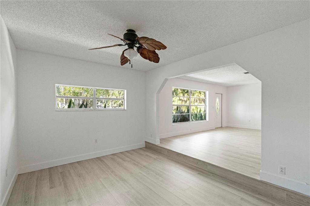 16900 Southwest 62nd Street Southwest Ranches, FL 33331 - Photo 24 of 48 an empty room with windows and fan