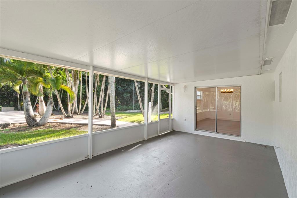 16900 Southwest 62nd Street Southwest Ranches, FL 33331 - Photo 32 of 48 wooden floor to ceiling window and an outdoor view
