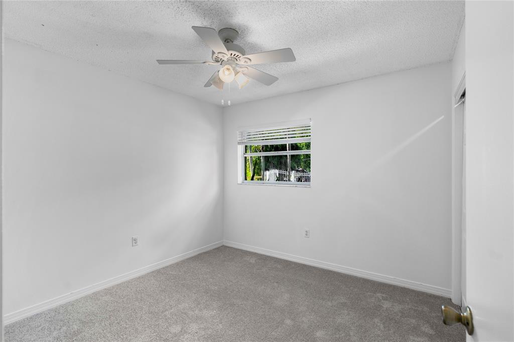 16900 Southwest 62nd Street Southwest Ranches, FL 33331 - Photo 33 of 48 a view of an empty room with chandelier fan