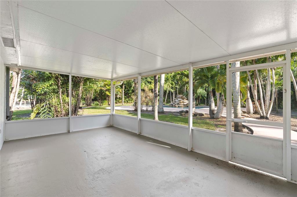 16900 Southwest 62nd Street Southwest Ranches, FL 33331 - Photo 35 of 48 an empty room with large windows