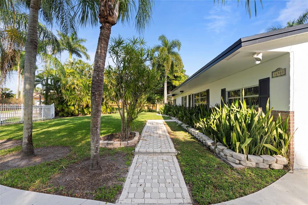 16900 Southwest 62nd Street Southwest Ranches, FL 33331 - Photo 38 of 48 a view of a pathway of a house with a garden