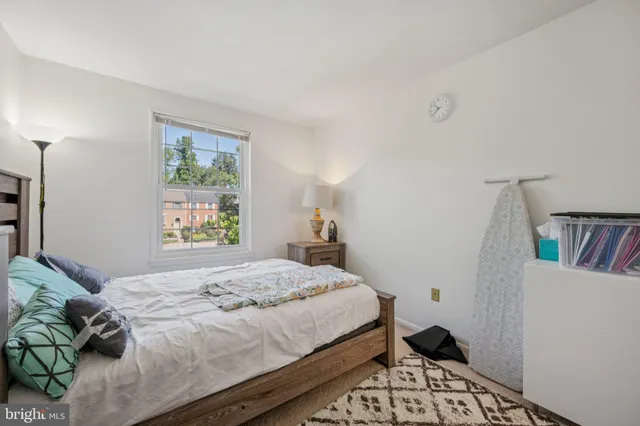 a bedroom with a bed and a window in it