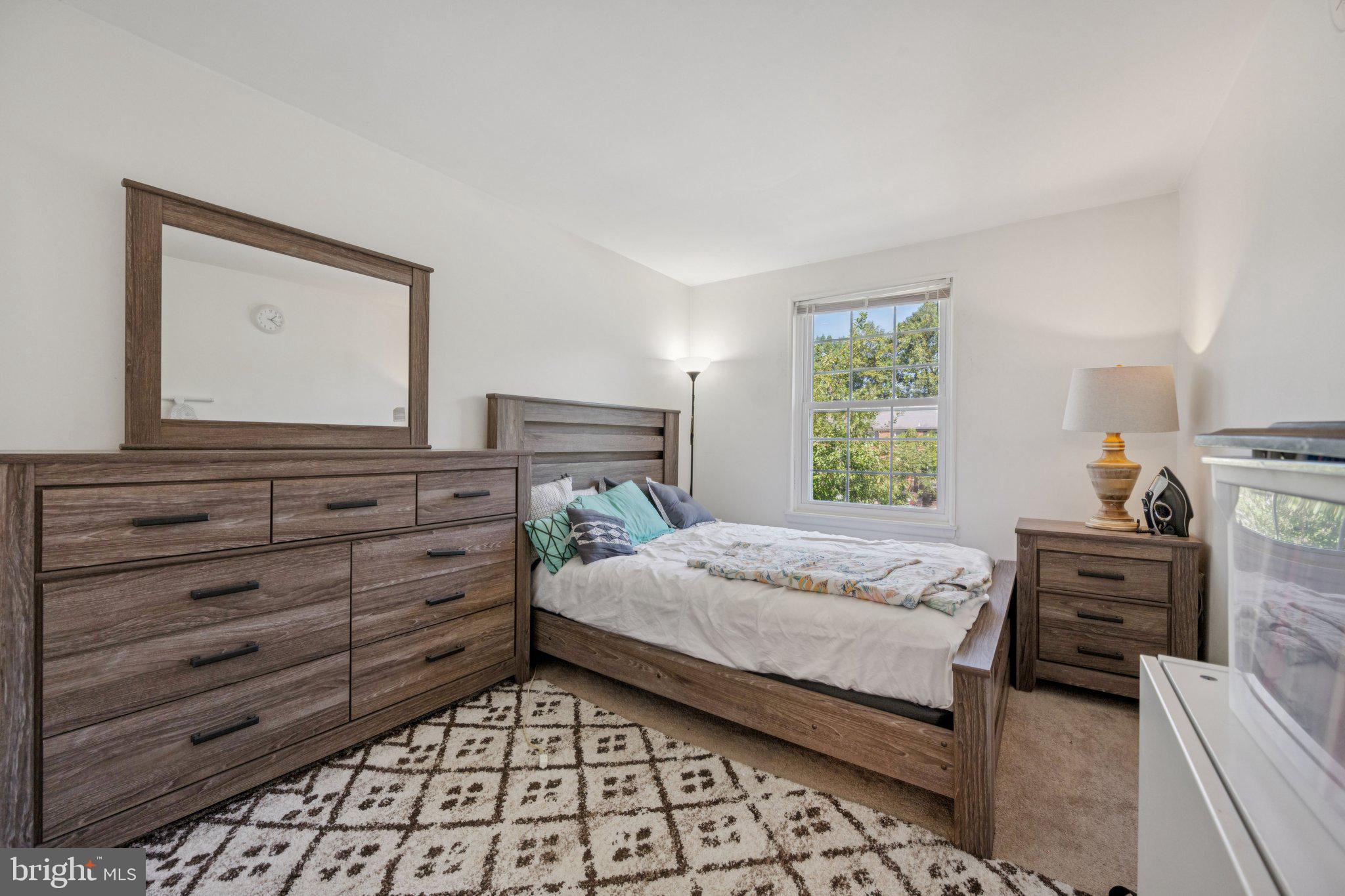 10522 East Wind Way Columbia, MD 21044 - Photo 15 of 21 a bedroom with a bed and a dresser