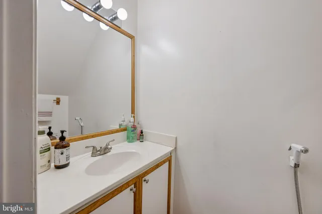 a bathroom with a sink and a mirror