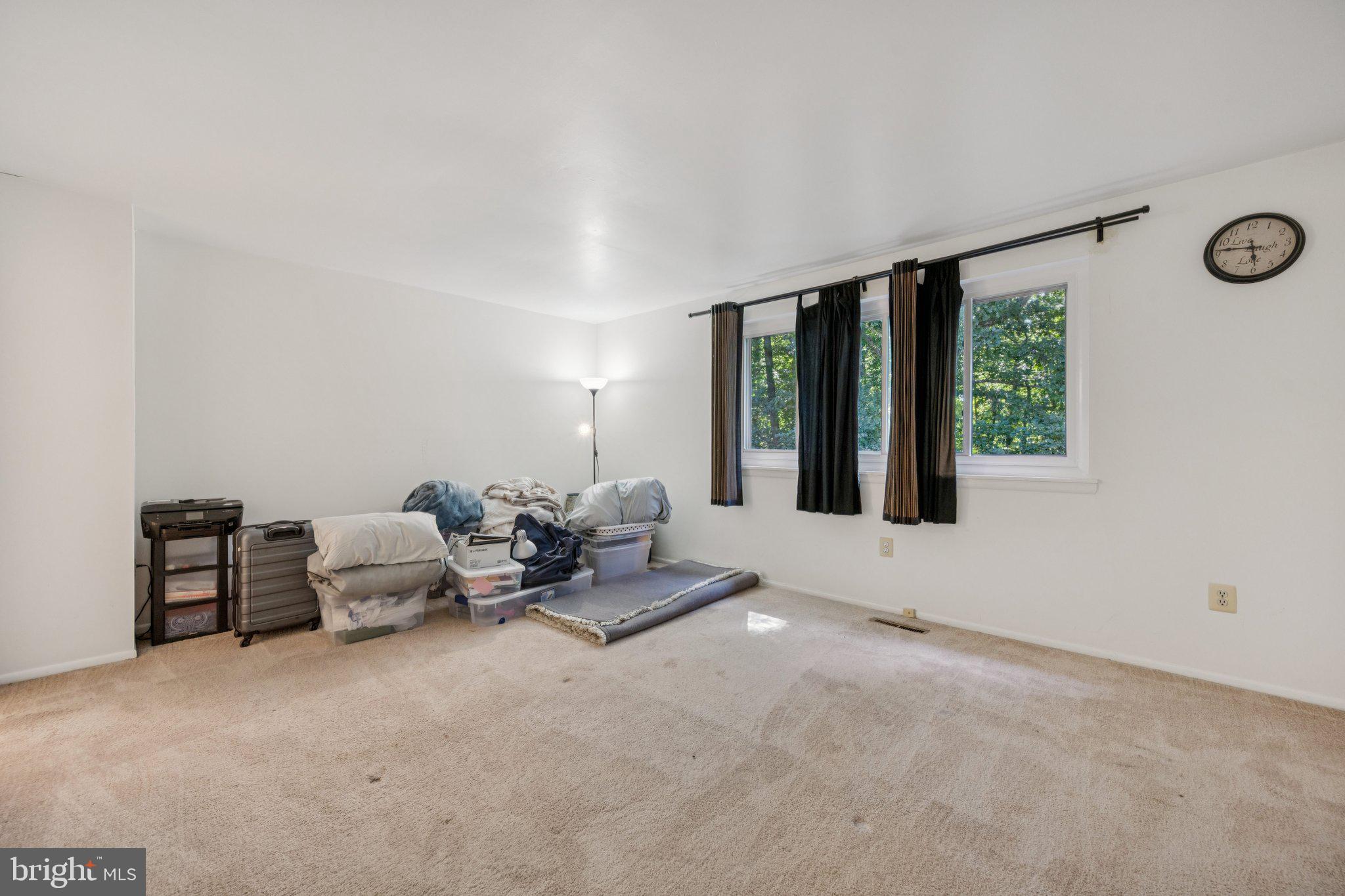 10522 East Wind Way Columbia, MD 21044 - Photo 9 of 21 a living room with furniture and large windows
