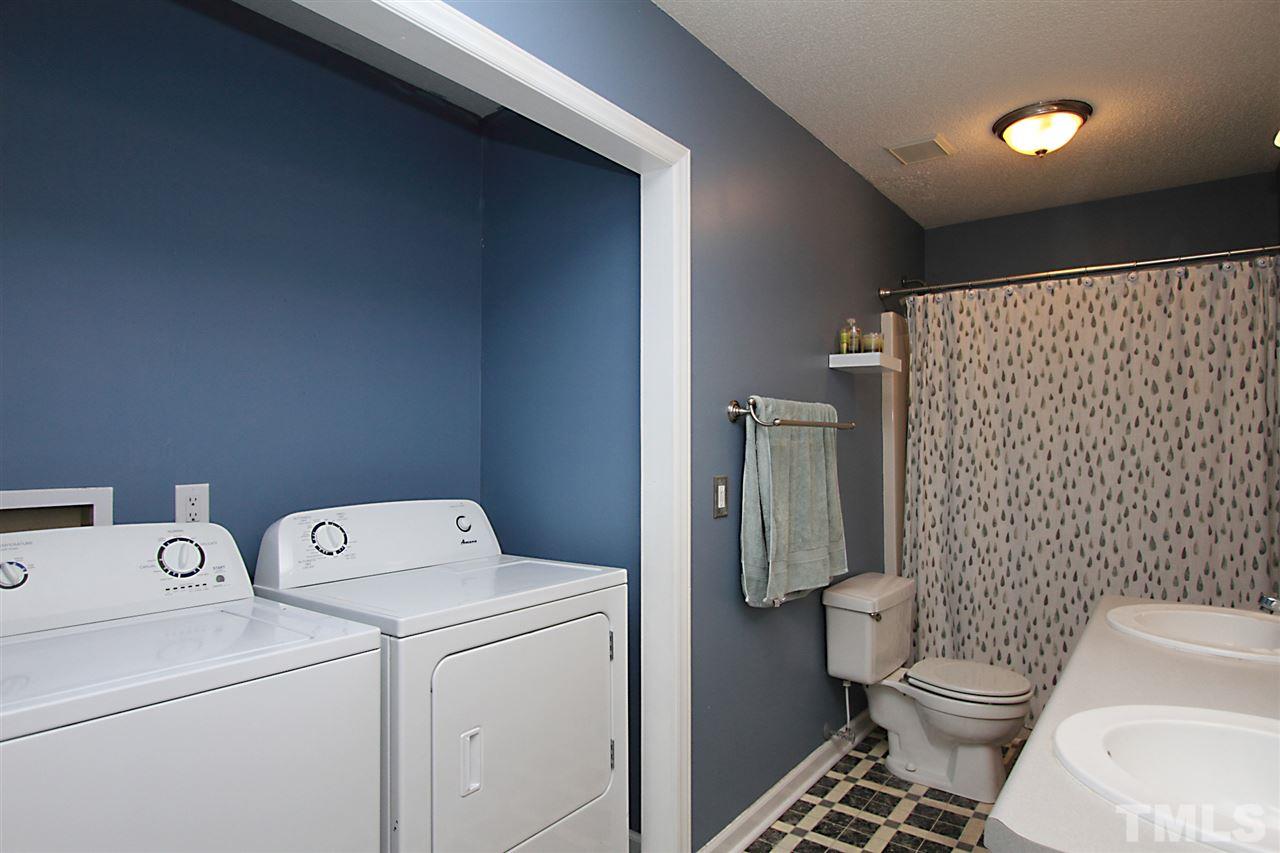 4213 Bluewing Road Raleigh, NC 27616 - Photo 13 of 16 a bathroom with a toilet and a shower
