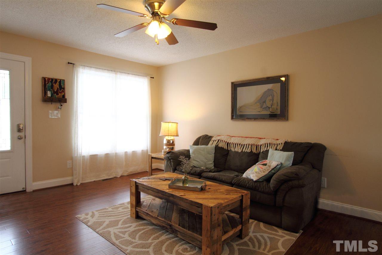 4213 Bluewing Road Raleigh, NC 27616 - Photo 3 of 16 a living room with furniture and a window