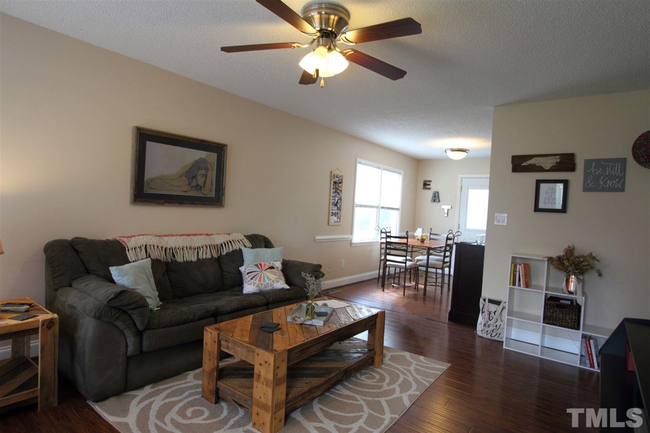 4213 Bluewing Road Raleigh, NC 27616 - Photo 4 of 16 a living room with furniture and wooden floor