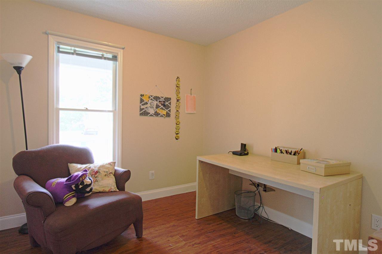 4213 Bluewing Road Raleigh, NC 27616 - Photo 9 of 16 a room with furniture and a window
