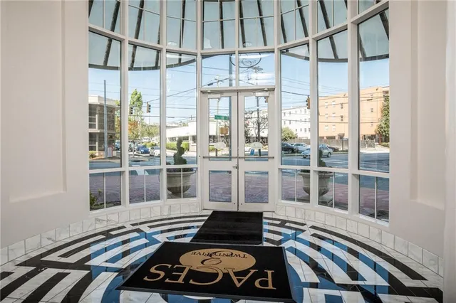 a picture of a room with wooden floor and windows