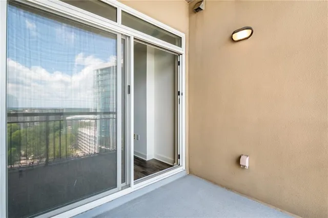 a bathroom with a glass shower door