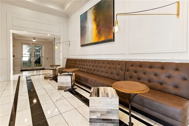 a living room with furniture and a rug