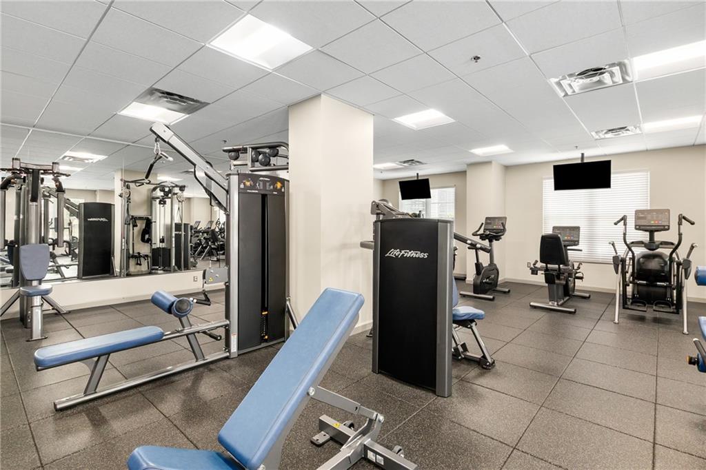 325 East Paces Ferry Road Northeast, Unit 1704 Atlanta, GA 30305 - Photo 40 of 43 a view of a room with gym equipment