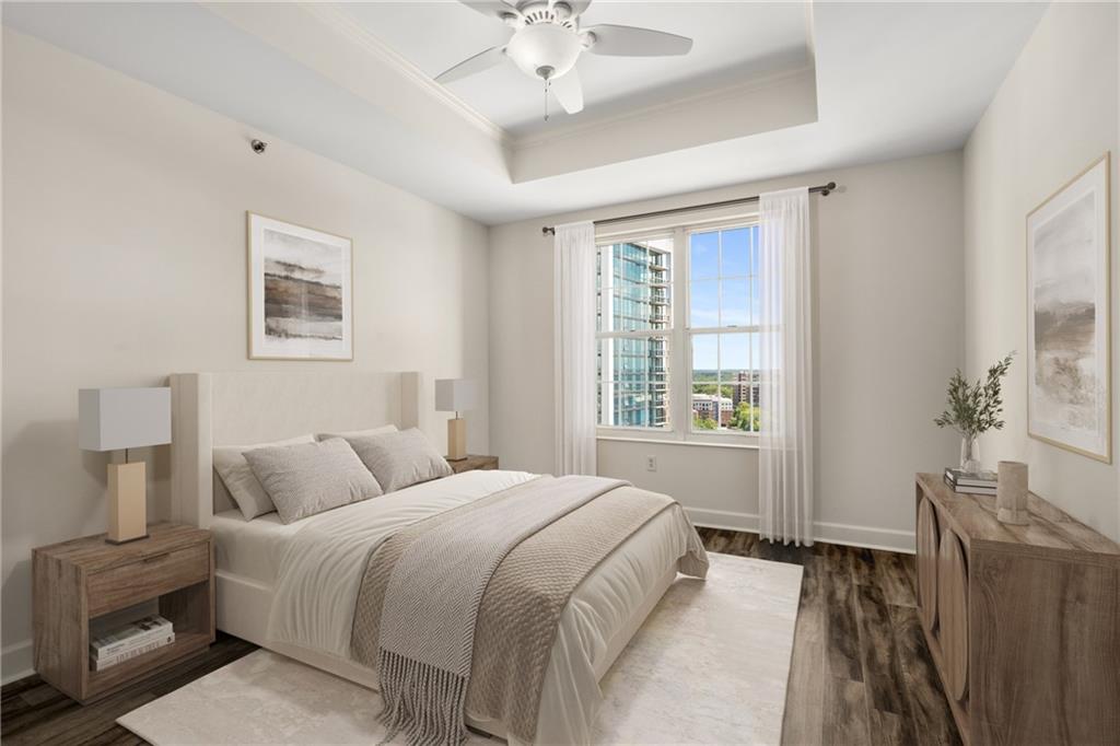 325 East Paces Ferry Road Northeast, Unit 1704 Atlanta, GA 30305 - Photo 7 of 43 a bedroom with a bed and a chandelier