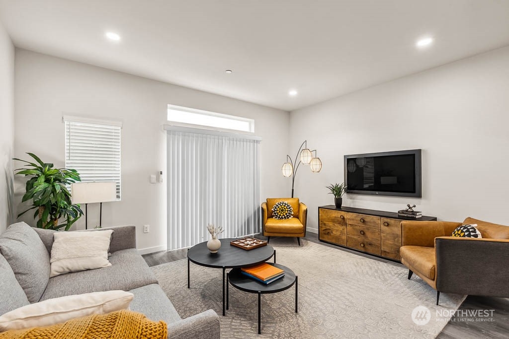16124 Cascadian Way, Unit G4 Bothell, WA 98012 - Photo 6 of 24 a living room with furniture and a flat screen tv