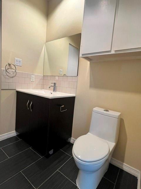 1100 West Trinity Mills Road, Unit 2001 Carrollton, TX 75006 - Photo 16 of 23 a bathroom with a sink toilet and mirror