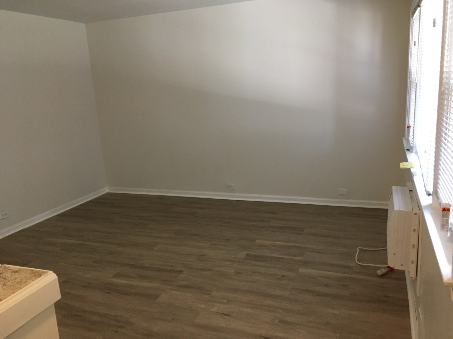 4313 South Harlem Avenue, Unit 3 Stickney, IL 60402 - Photo 4 of 8 a view of wooden floor and brick walls