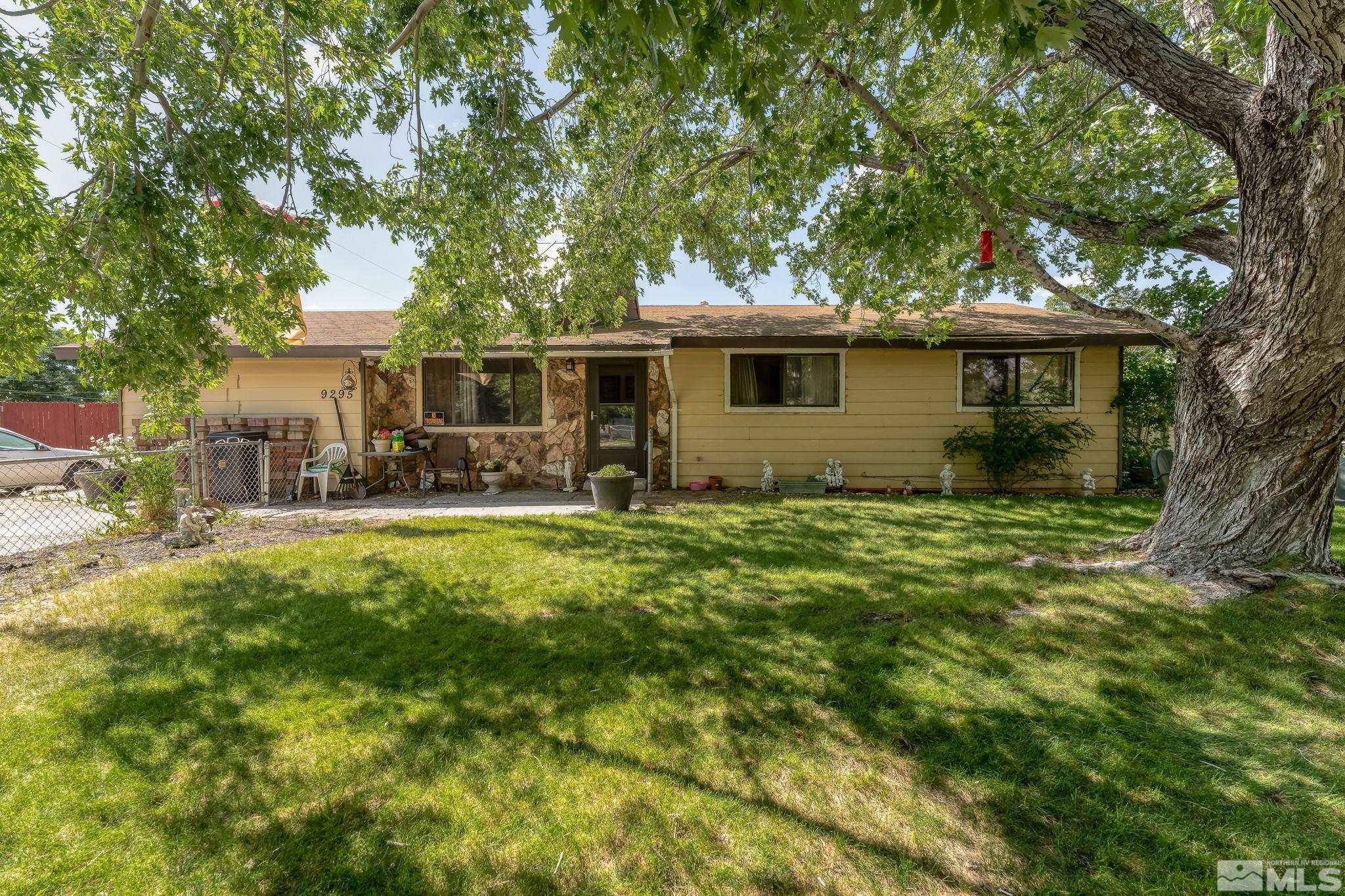 9295 Fremont Way Reno, NV 89506 - Photo 1 of 37 a front view of house with yard and green space