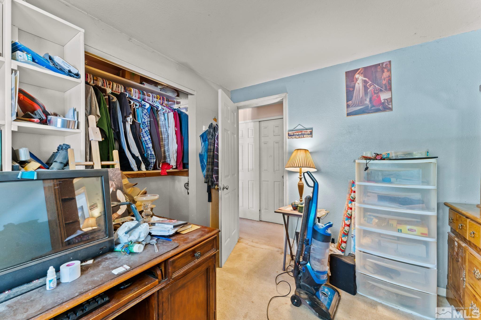9295 Fremont Way Reno, NV 89506 - Photo 17 of 37 a view of walk in closet with clothes and shoes