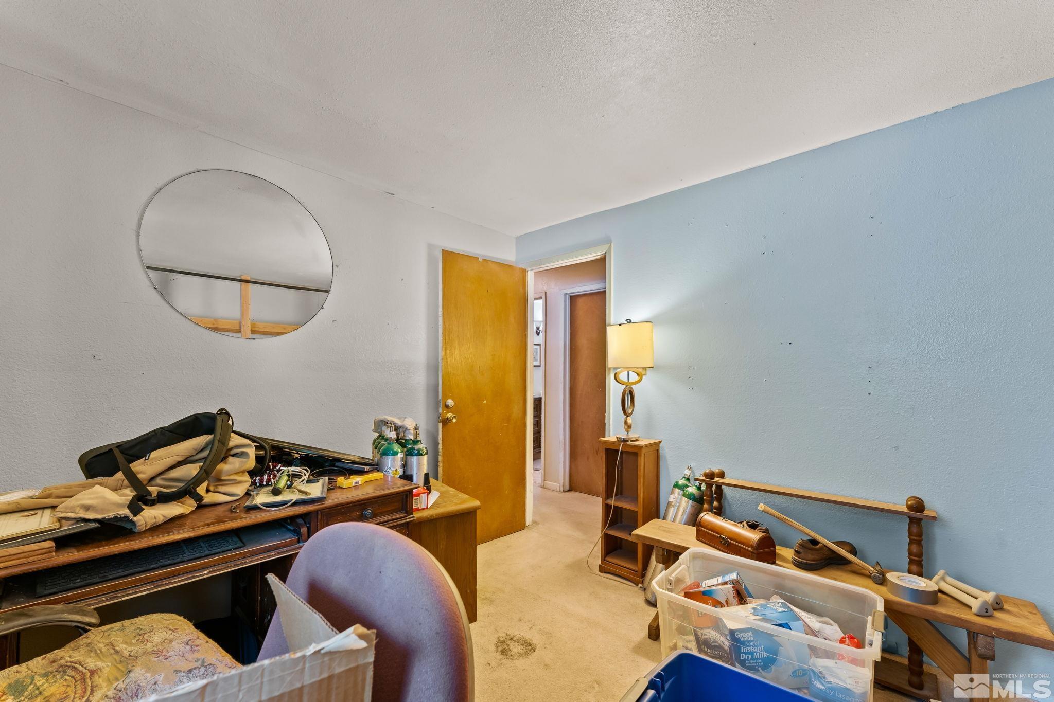9295 Fremont Way Reno, NV 89506 - Photo 20 of 37 a bedroom with furniture and a window