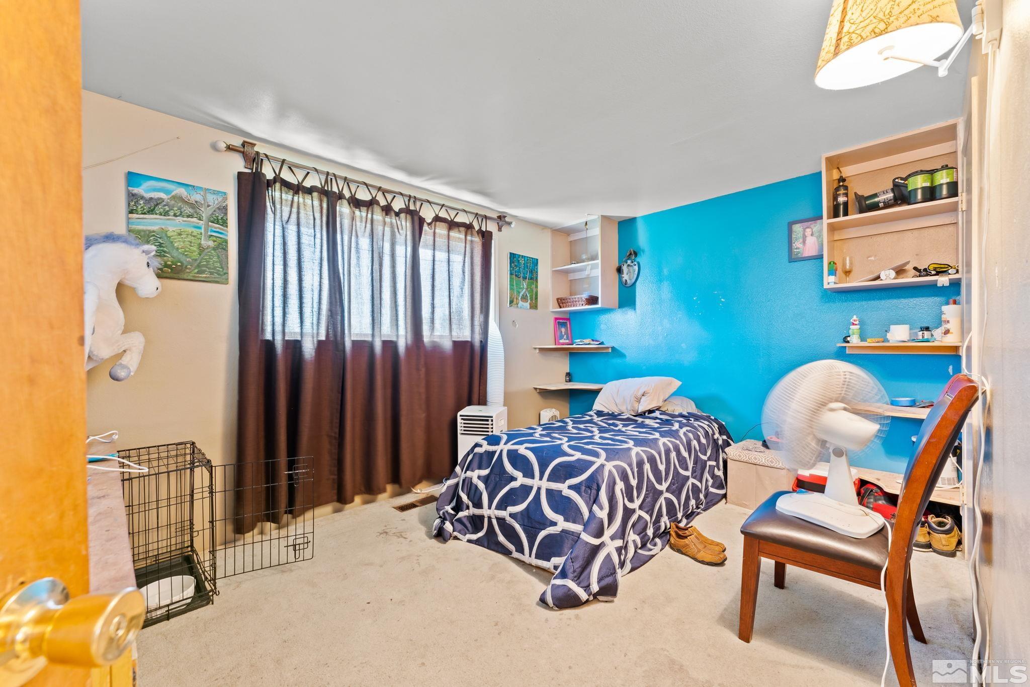 9295 Fremont Way Reno, NV 89506 - Photo 22 of 37 a bedroom with a bed and a window