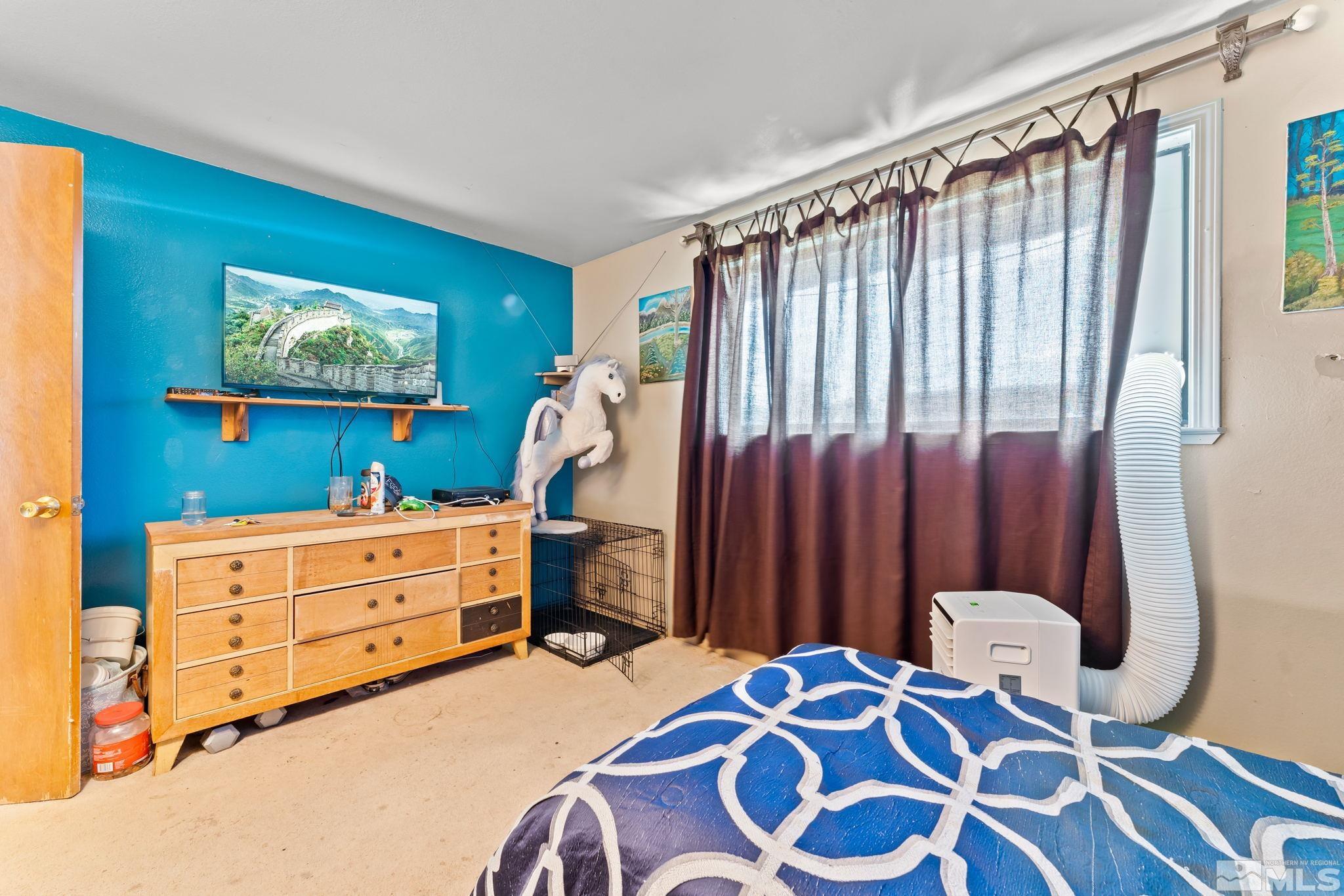 9295 Fremont Way Reno, NV 89506 - Photo 23 of 37 a bedroom with a bed and a dresser