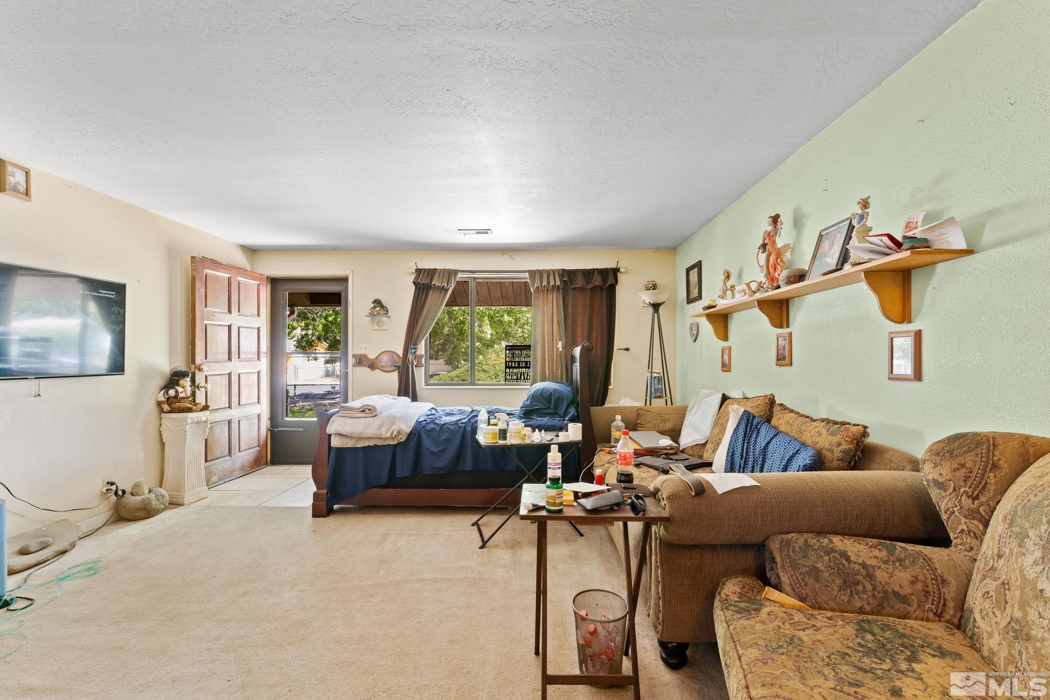 9295 Fremont Way Reno, NV 89506 - Photo 3 of 37 a living room with furniture and a large window
