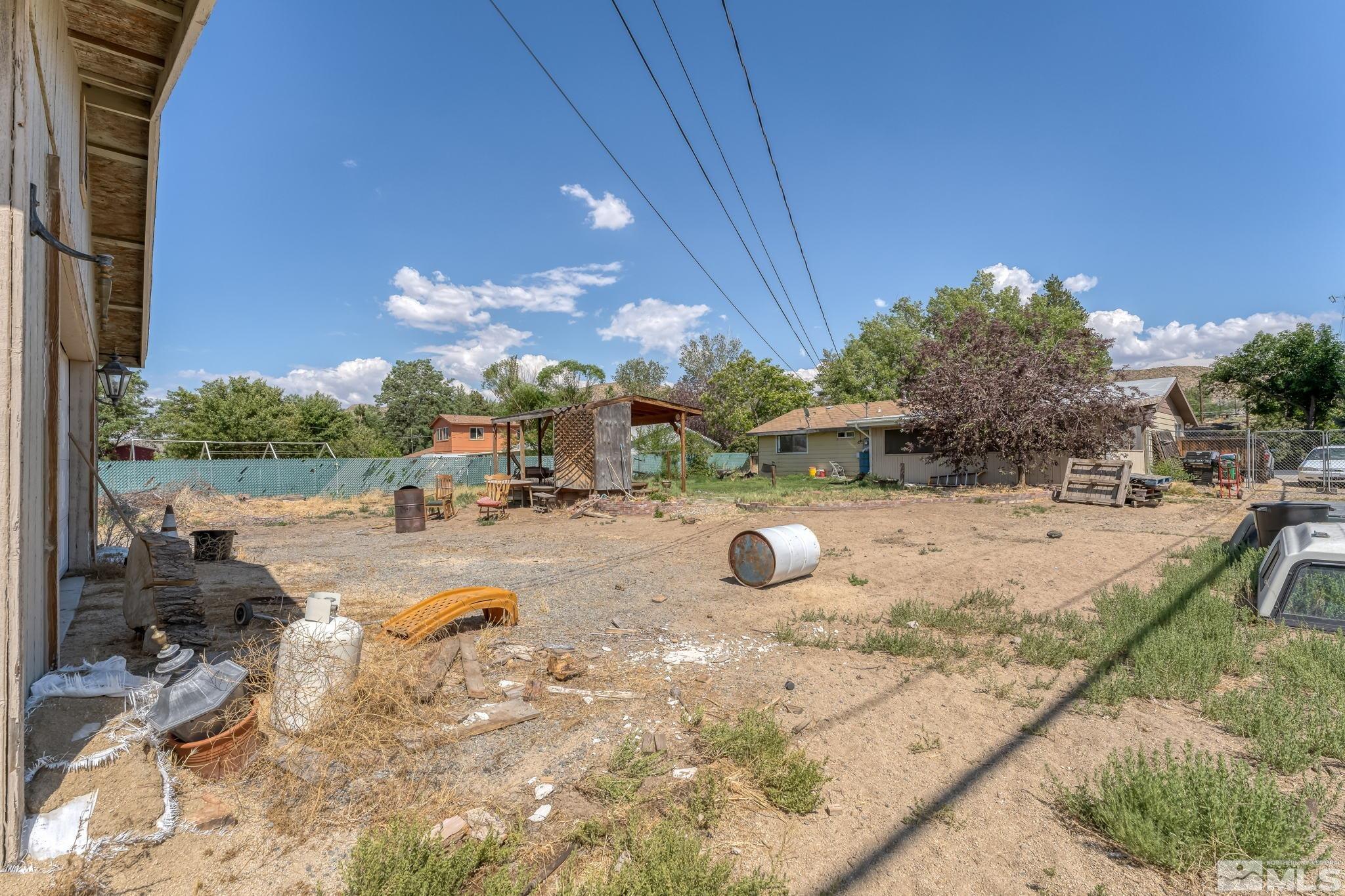 9295 Fremont Way Reno, NV 89506 - Photo 33 of 37 a view of a swimming pool with a patio and yard