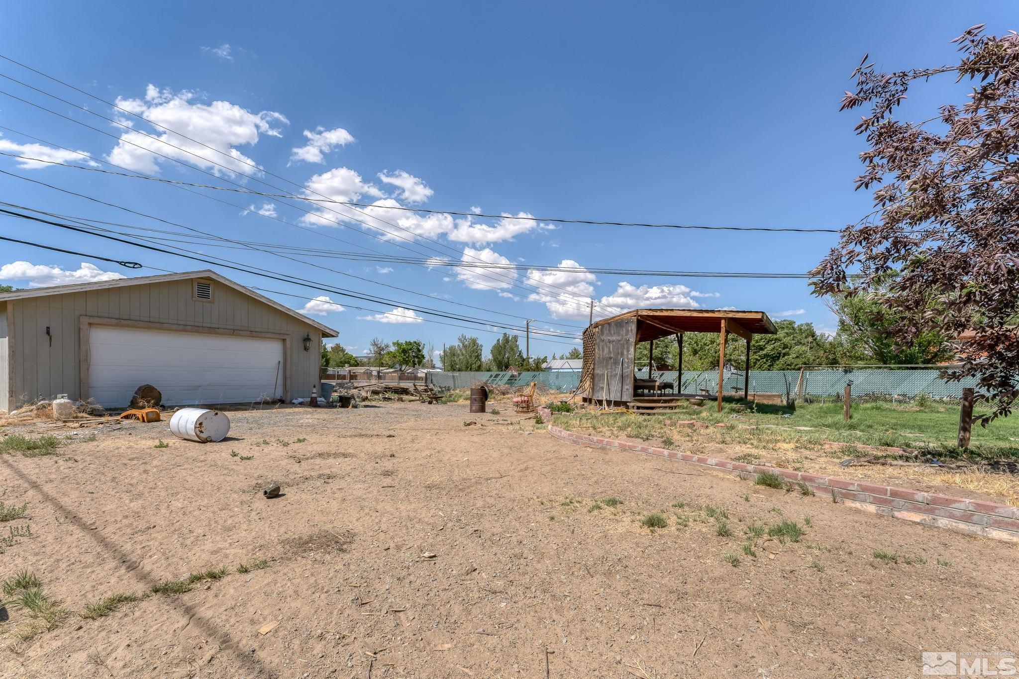 9295 Fremont Way Reno, NV 89506 - Photo 34 of 37 a view of a yard with a tree
