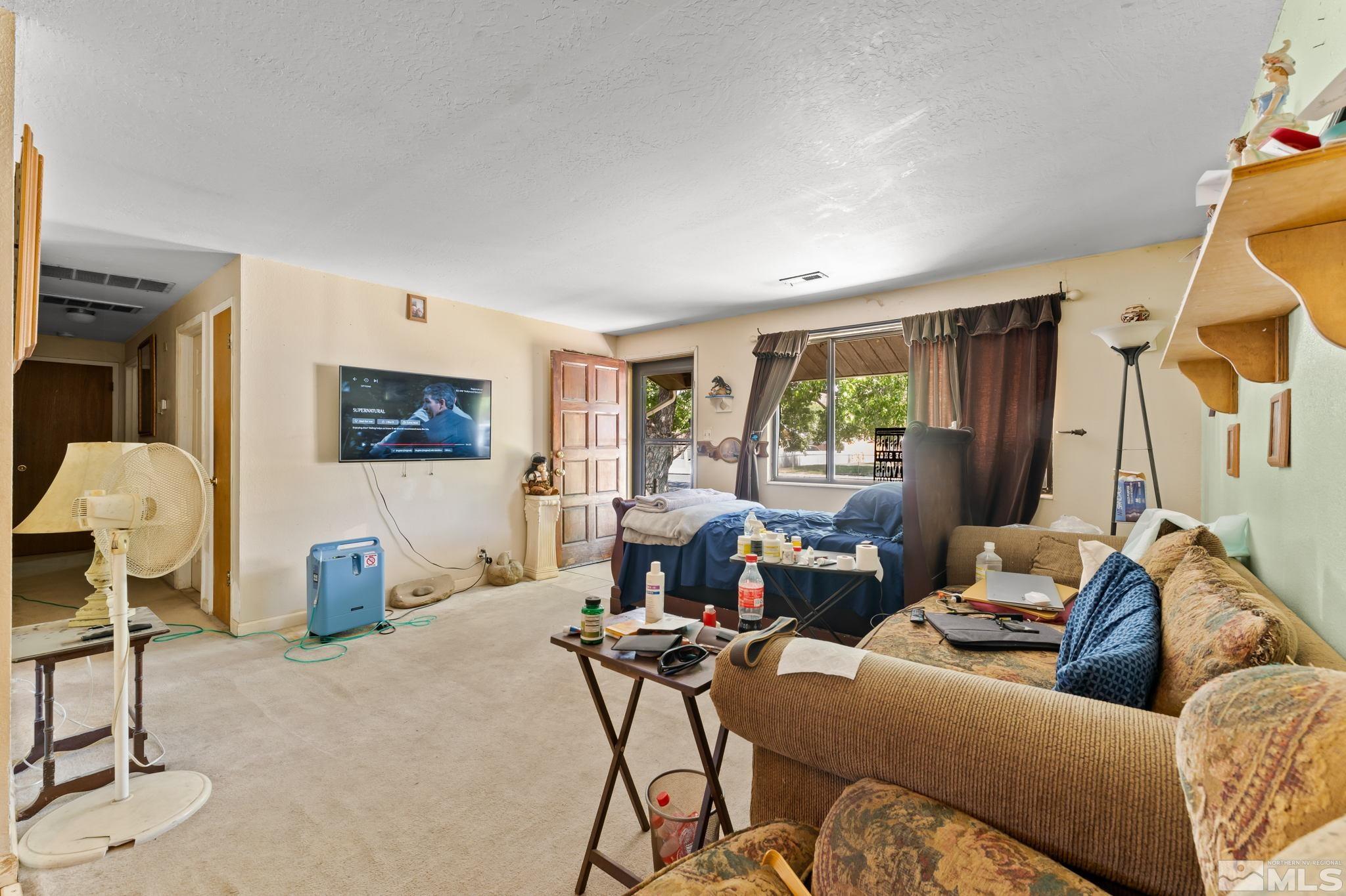9295 Fremont Way Reno, NV 89506 - Photo 4 of 37 a living room with furniture and a window
