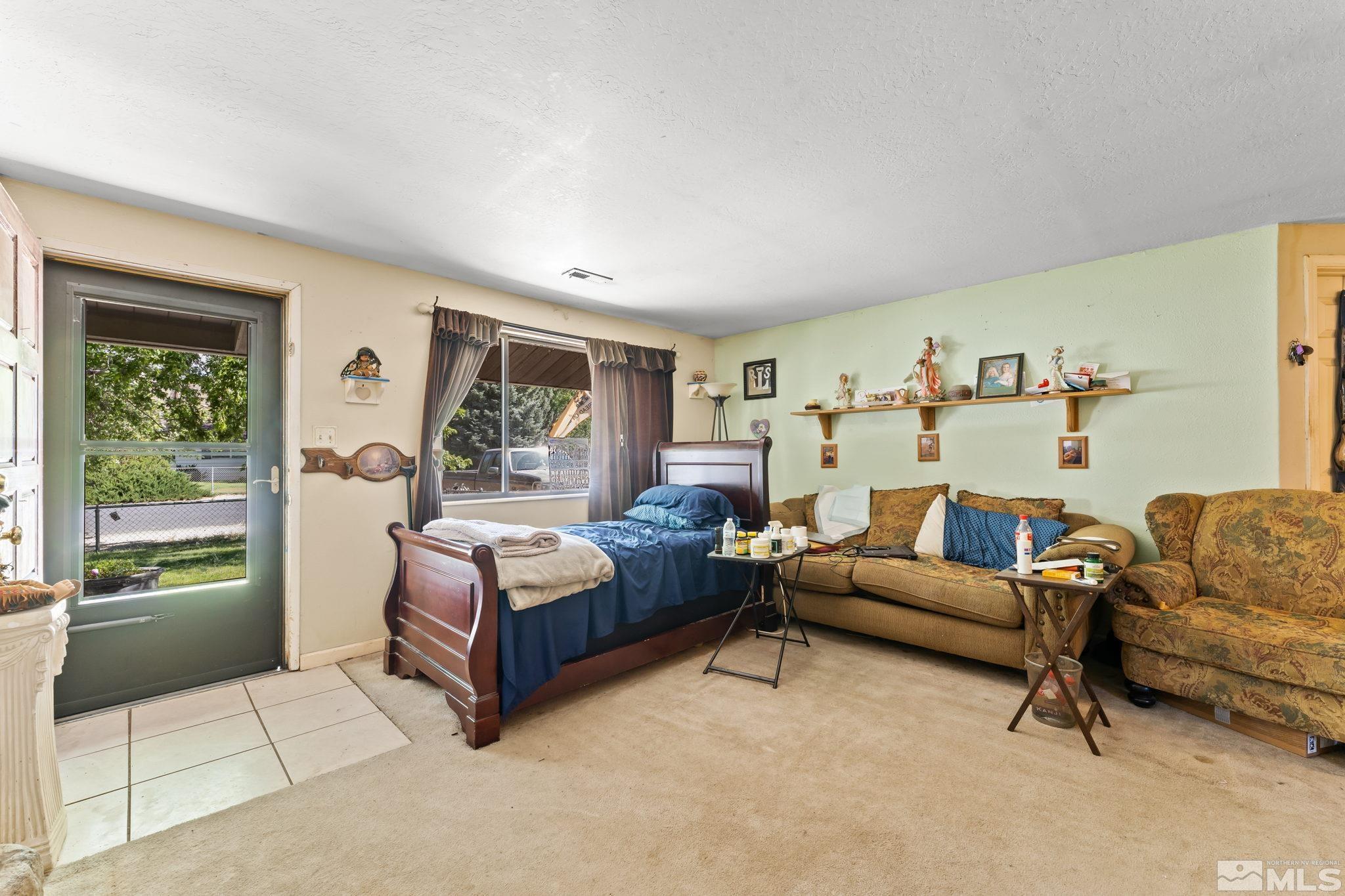 9295 Fremont Way Reno, NV 89506 - Photo 5 of 37 a living room with furniture and a window